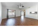 Living room with dark laminate floors and ceiling fan at 6508 Roy Rogers Dr, Las Vegas, NV 89108