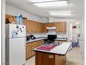 Kitchen with island and ample cabinets at 511 E Simkins Rd, Pahrump, NV 89060