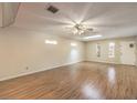 Spacious living room featuring hardwood floors and a ceiling fan at 1008 Sproul Ct, Las Vegas, NV 89145