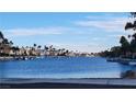 Scenic waterfront view with houses and palm trees along the canal at 3151 Soaring Gulls Dr # 1038, Las Vegas, NV 89128