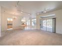 Open living room with high ceilings and view to kitchen at 10612 Argents Hill Dr, Las Vegas, NV 89134