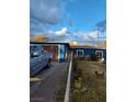 Blue house with a yard, fence, and a truck parked in front at 2108 Lenwood Ave, North Las Vegas, NV 89030