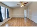 Living room featuring laminate flooring and ceiling fan at 311 Sir George Dr, Las Vegas, NV 89110