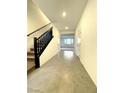 Bright entryway with staircase and view to Gathering room at 7474 Lodano Ave, Las Vegas, NV 89113