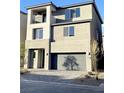 Modern three-story home with balcony and two-car garage at 7474 Lodano Ave, Las Vegas, NV 89113