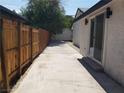 Long concrete patio, wooden fence, and spacious backyard at 3123 Congress Ave, Las Vegas, NV 89121