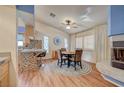 Bright dining area with a fireplace and hardwood floors at 2035 E Warm Springs Rd # 1019, Las Vegas, NV 89119