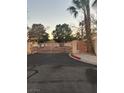 Gated community entrance with palm trees at 2105 Velvet Hill Ave, Las Vegas, NV 89106