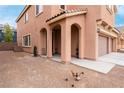 Side view of two-story house with covered entryway at 3718 True Spring Pl, North Las Vegas, NV 89032