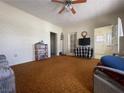 Living Room with carpet, ceiling fan, and various furniture at 47 Fourth St, McGill, NV 89318