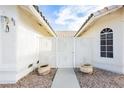 Front entry with a walkway and decorative pots at 3576 Judah Way, Las Vegas, NV 89147