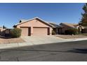 Single-story house with three-car garage and desert landscaping at 6824 Little Brook St, Las Vegas, NV 89131