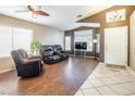 Spacious living room with tile floors, recessed lighting, and a view of the backyard at 3701 White Angel Dr, North Las Vegas, NV 89032