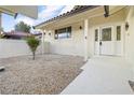 Inviting front entrance with a white door and walkway at 4134 Pequeno Ave, Las Vegas, NV 89120