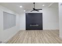 Living room featuring a modern fireplace and light wood flooring at 4134 Pequeno Ave, Las Vegas, NV 89120