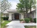 Inviting front entrance with double doors, landscaping, and a walkway at 3767 Darren Thornton Way, Las Vegas, NV 89120