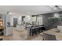 Spacious kitchen featuring white cabinets, granite countertops, and an island at 10881 Pentland Downs St, Las Vegas, NV 89141