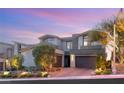 Contemporary home showcasing architectural details and meticulous landscaping at 49 Vista Outlook St, Henderson, NV 89011