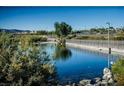 Community pond with walking path and scenic views at 50 Aura De Blanco St # 17101, Henderson, NV 89074