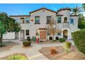 Building exterior, showing multiple units and landscaping at 50 Aura De Blanco St # 17101, Henderson, NV 89074