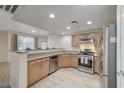 Modern kitchen with stainless steel appliances and granite countertops at 50 Aura De Blanco St # 17101, Henderson, NV 89074