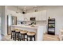 Modern kitchen with white cabinetry, stainless steel appliances, and an island at 1164 Prospering Creek St, Las Vegas, NV 89135