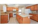 Kitchen with granite countertops and wood cabinets at 4337 Threshold Ct, North Las Vegas, NV 89032