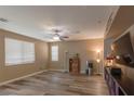 Relaxing Gathering room with hardwood floors and large window at 6417 Winter Moon St, North Las Vegas, NV 89084