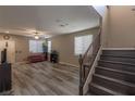 Bright living room with hardwood floors and a staircase at 6417 Winter Moon St, North Las Vegas, NV 89084