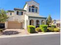 Two-story house with a neutral color palette and landscaped front yard at 6647 Rego Park Ct, Las Vegas, NV 89166