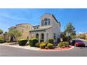 Two-story house with a neutral color palette and landscaped front yard at 6647 Rego Park Ct, Las Vegas, NV 89166