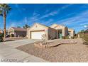 Single-story house with attached garage and desert landscaping at 2188 Chapman Ranch Dr, Henderson, NV 89012