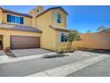 Two-story townhome with brown garage door and side yard at 1196 Pancole Ct # 0, Henderson, NV 89052