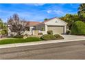 Single-story house with a two-car garage and nicely landscaped front yard at 2576 Springville Way, Henderson, NV 89052