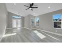 Bright living room with hardwood floors and recessed lighting at 6031 Orange Hill Dr, Las Vegas, NV 89142