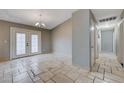 Dining area with tile floors and French doors leading to the outside at 180 Lido Cir, Henderson, NV 89015