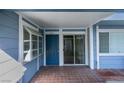 Condo unit's private entrance with blue door and tiled patio at 5345 Rod Ct # 101, Las Vegas, NV 89122