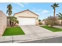 Attached garage with artificial turf landscaping at 789 Salt Flats Cir, Henderson, NV 89011