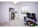 Home office with window, carpet, and mirrored closet doors at 591 Hagens Aly, Mesquite, NV 89027