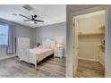 Bright bedroom with a white queen-size bed and walk-in closet at 6297 Starflare St, Las Vegas, NV 89148