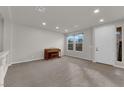 Living room with hardwood floors, large windows, and a view of the entrance at 8256 Dover Canyon Ct, Las Vegas, NV 89139