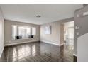 Spacious living room with tile floors and bay window at 352 Dockside Ct, Las Vegas, NV 89145