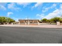 House with a long driveway and gated entrance at 647 Foxhall Rd, Henderson, NV 89002