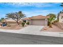 Front view of a single story house with a two car garage at 10901 Black Ledge Ave, Las Vegas, NV 89134