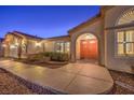 Front entryway with double doors and walkway at 1052 Hollyhock Dr, Henderson, NV 89011