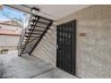 Private entrance with a secure door and exterior staircase at 2451 N Rainbow Blvd # 1083, Las Vegas, NV 89108