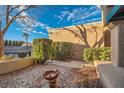 Small backyard patio with gravel and fountain feature at 2736 Desert Crystal Dr, Las Vegas, NV 89134