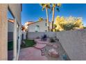 Landscaped backyard with patio and seating area at 3258 Epson St, Las Vegas, NV 89129