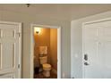 Small, updated half bathroom with a toilet and sink at 150 Las Vegas Blvd # 1104, Las Vegas, NV 89101