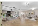 Bright and airy living room with hardwood floors and a modern fireplace at 4234 Seville St, Las Vegas, NV 89121